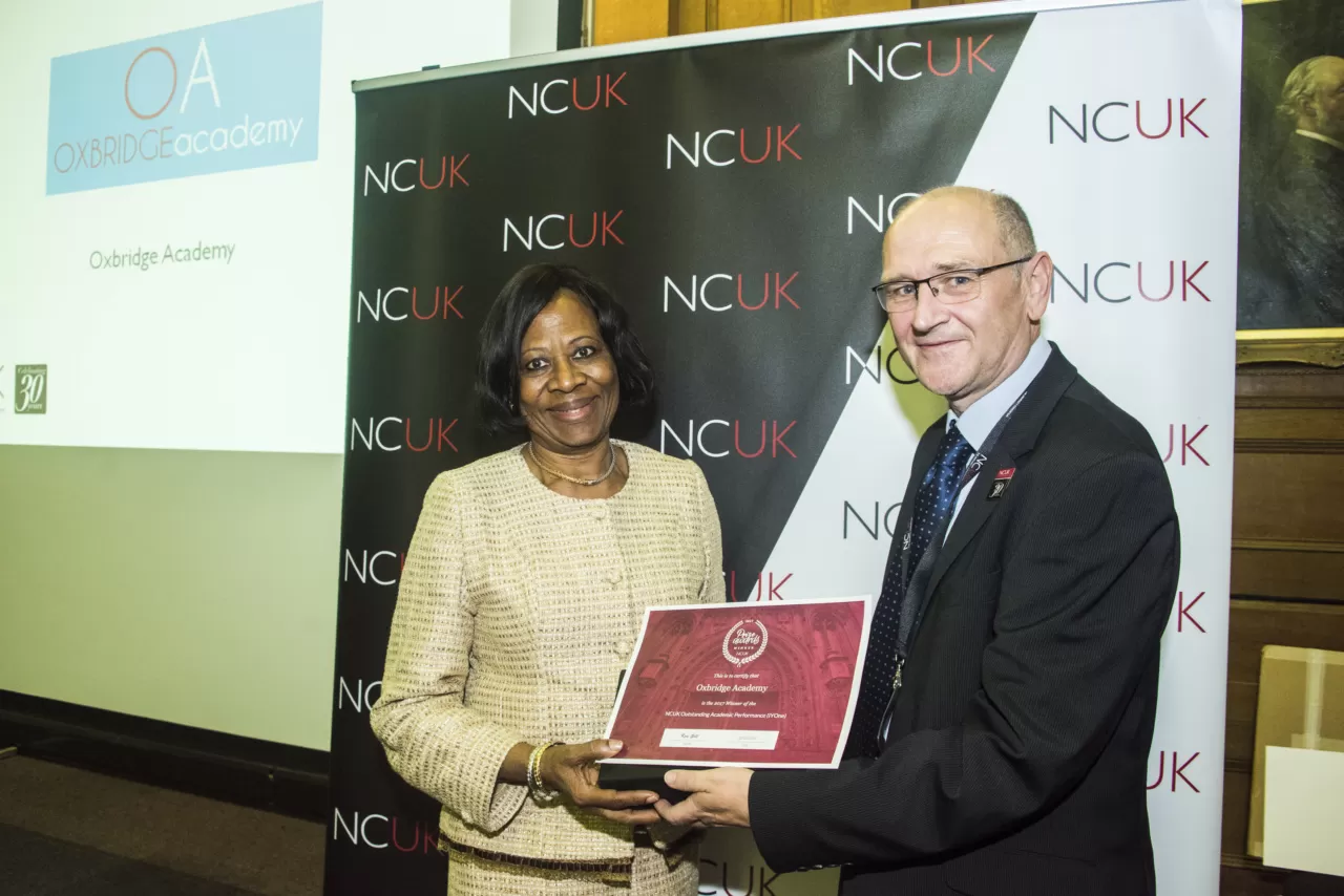 Dr Femi Ogunsanya receiving the NCUK Outstanding Academic Award in 2017 on behalf of Oxbridge Academy.