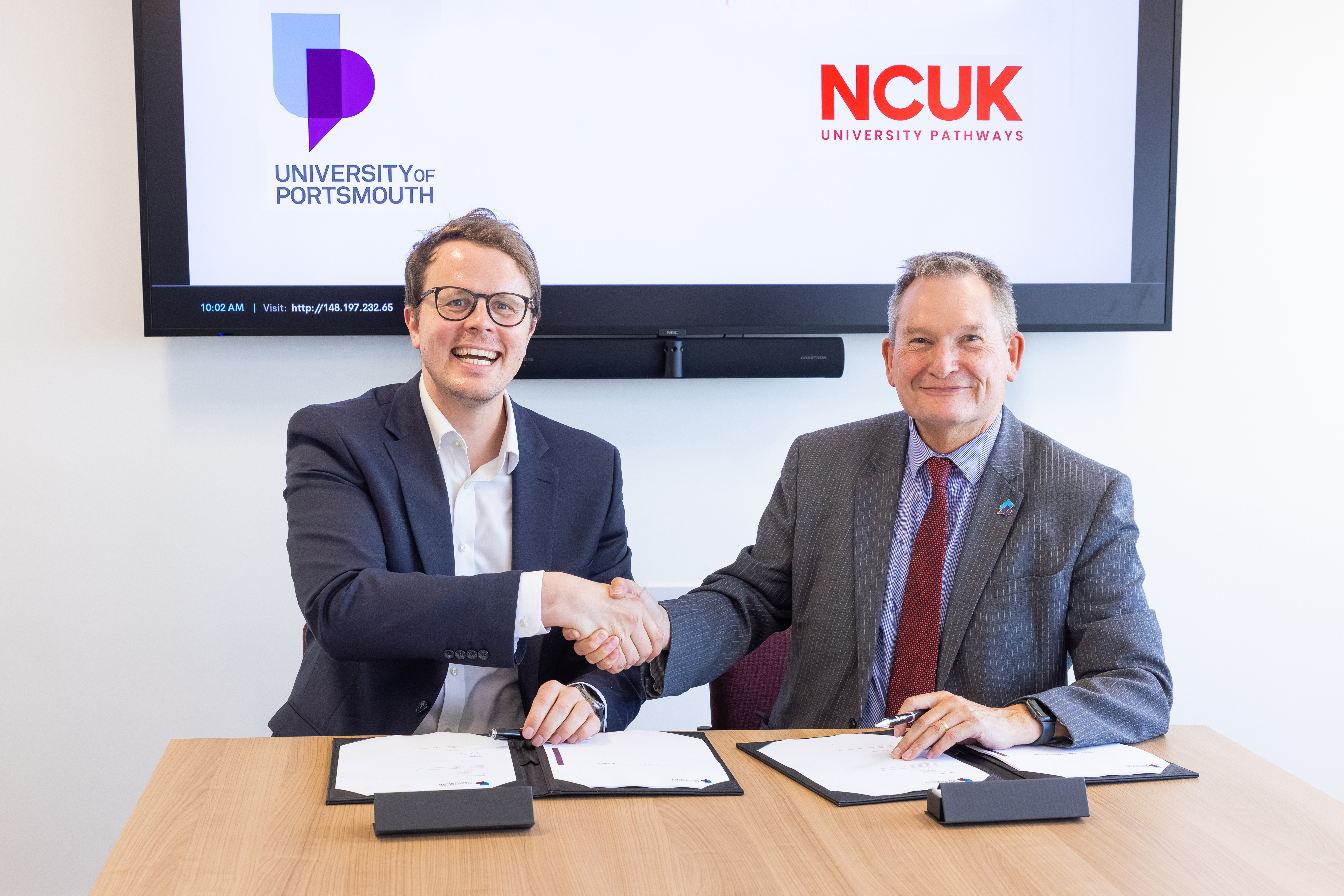 NCUK Chief Executive Officer Stuart Smith and University of Portsmouth Vice-Chancellor Professor Graham Galbraith CBE