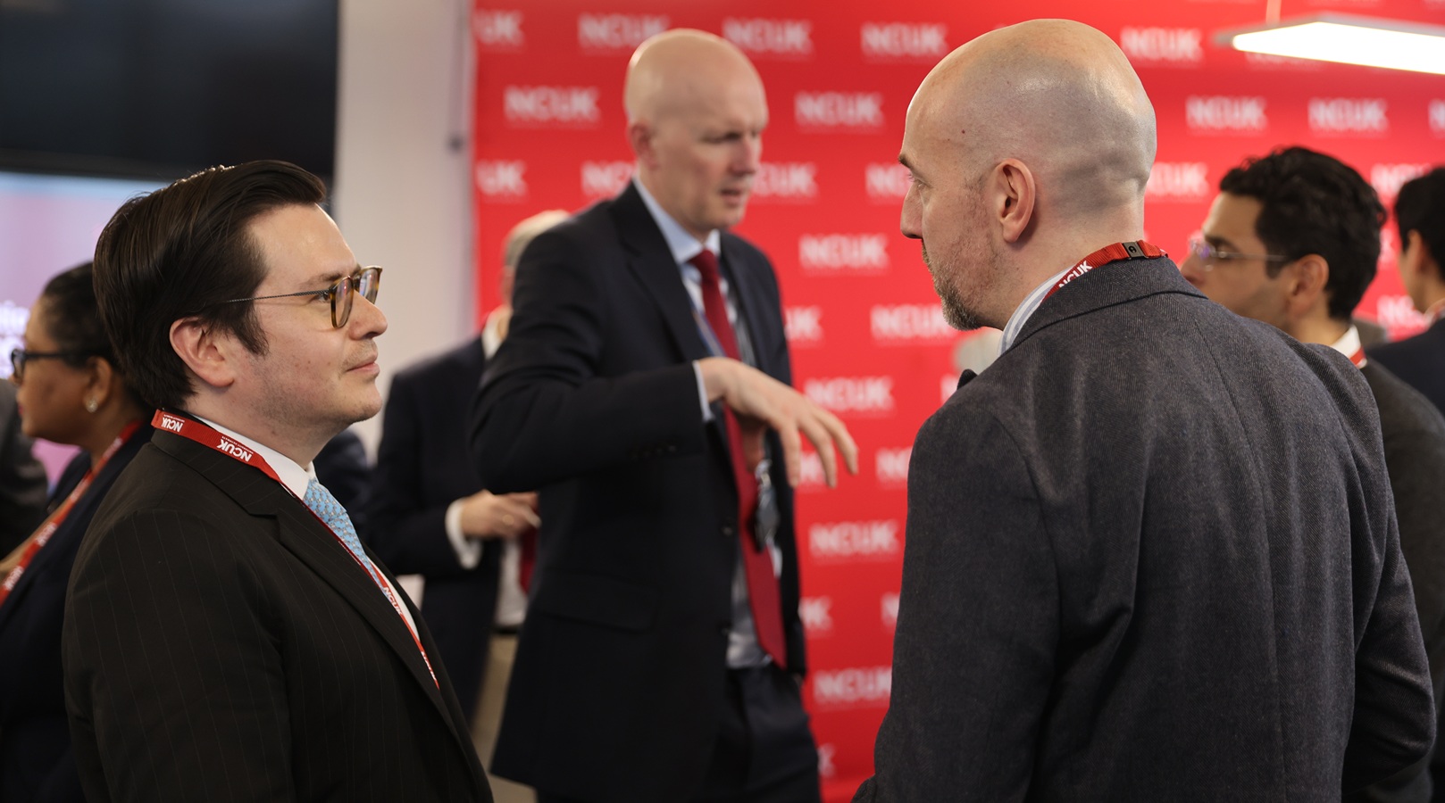 Delegates speaking at event