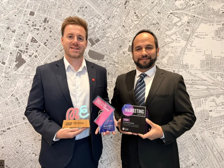 Marketing staff holding awards